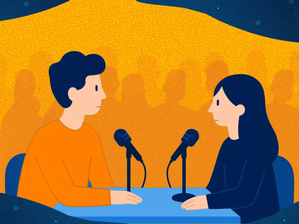 a man and woman sitting at a table with microphones - How to Plan a Crypto AMA: Format, Promotion and Tips