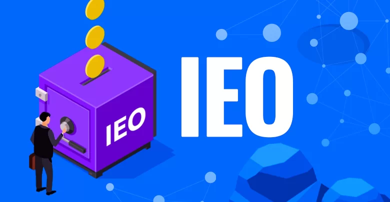 Purple box labeled IEO with coins - How to Promote an IEO in 2026: Marketing Guide